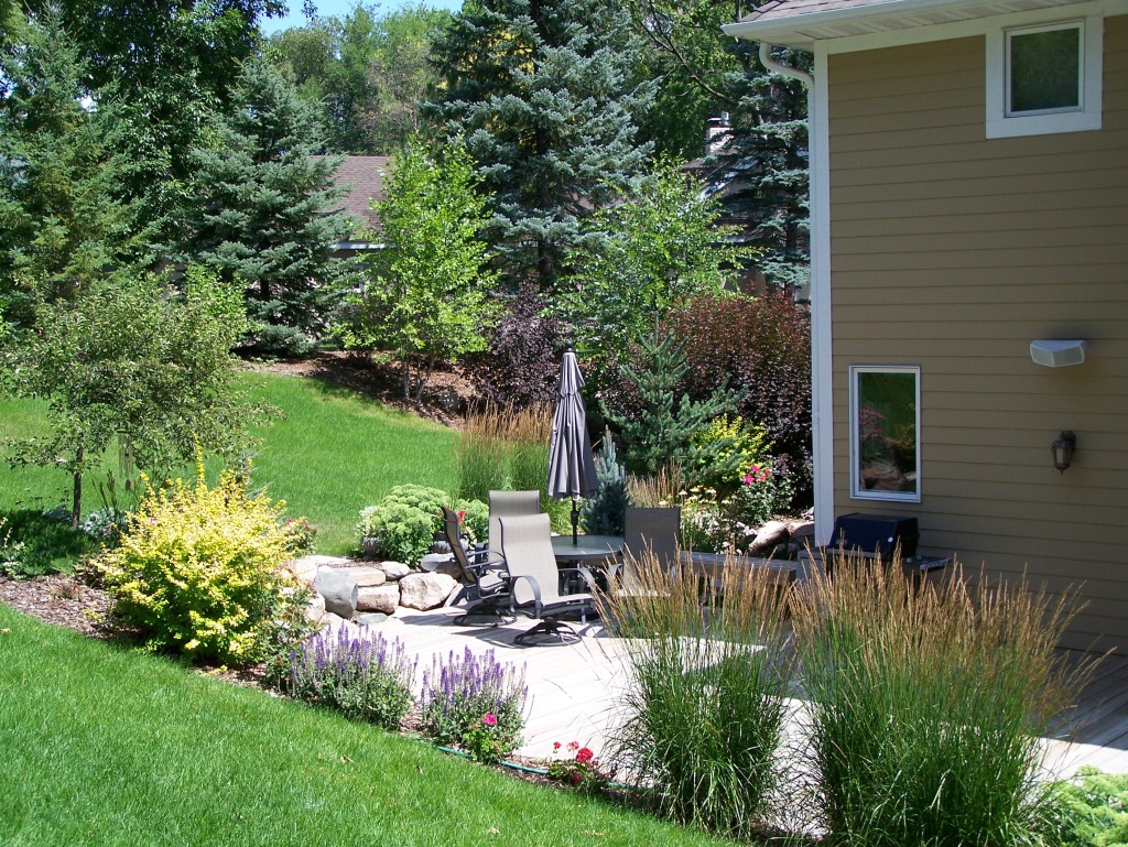 A ground-level deck with integrated plantings.