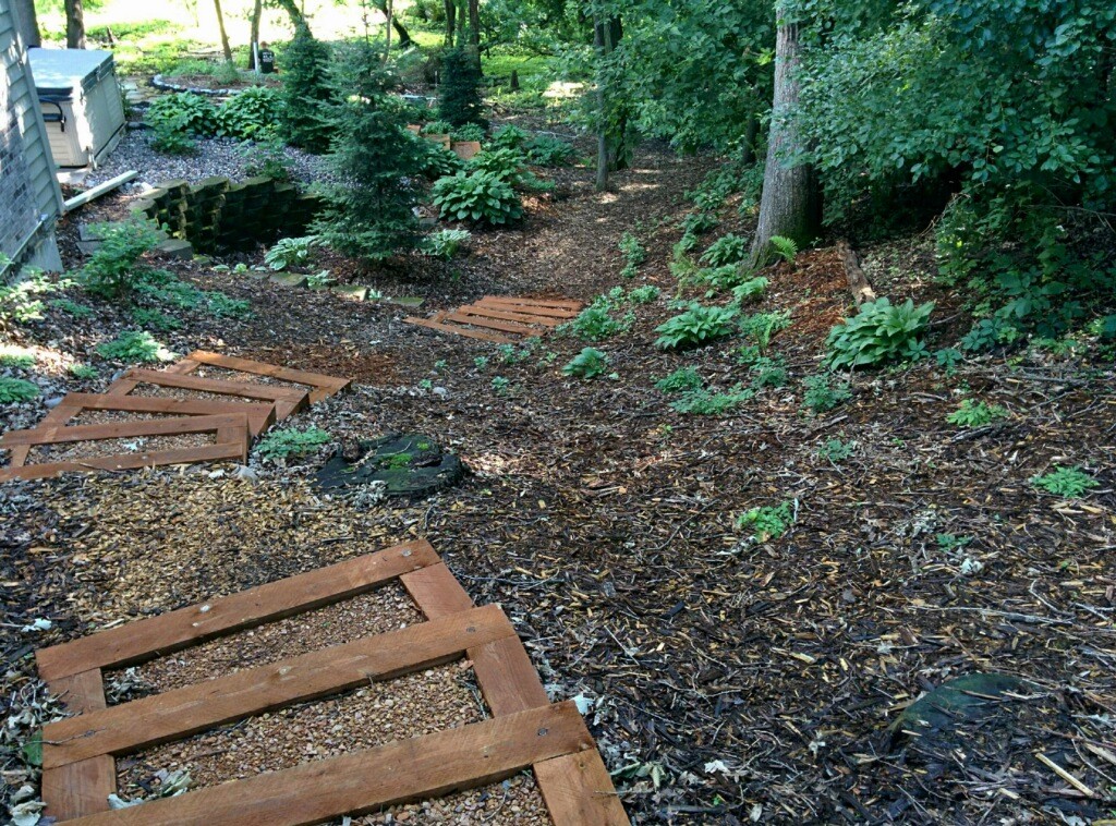 Steps were installed at a project in Eden Prairie to access a woodsy in the back yard. Great Goats also planted trees and shrubs that will be low-maintenance while thriving in the area.
